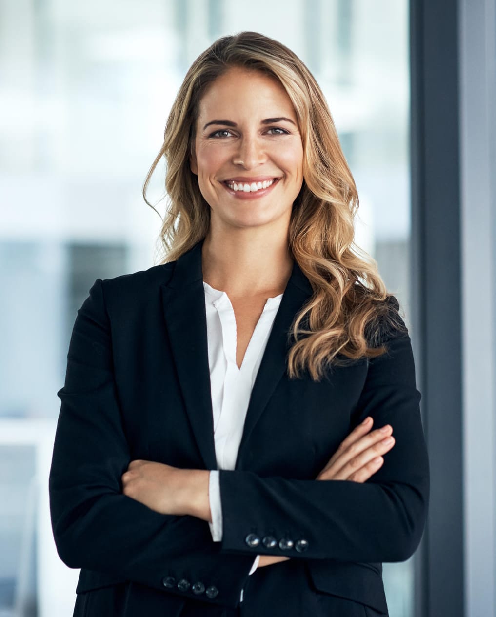 Shot of a confident young businesswoman standing in a modern office